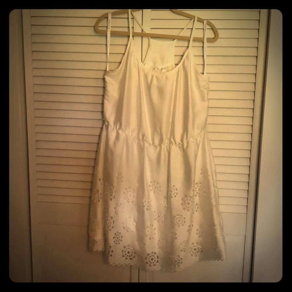 Silky soft white dress with flower cutouts